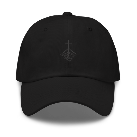 CLVRY Cap, Blackout Edition: black cap with a tone-on-tone printed cross-and-roots logo (front)